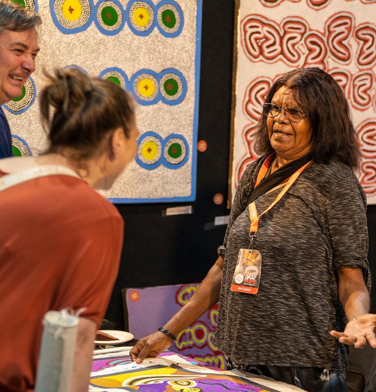 Artist talking to visitors at DAAF